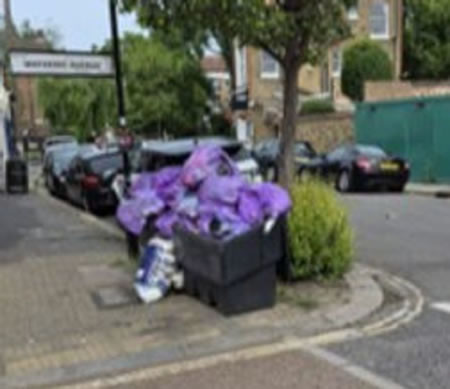 Overflowing recycling bin 