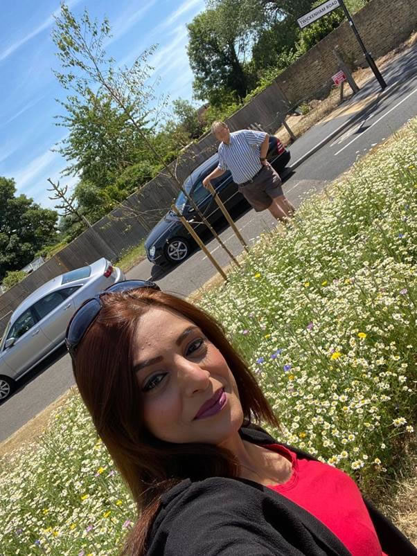 A person posing for a picture Description automatically generated