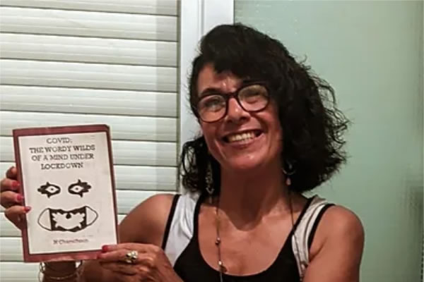 Nayma Chamchoun with her published collection of poems 