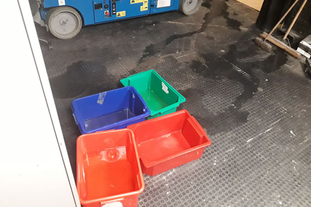 Buckets collecting water from leaks in the roof at the Questors