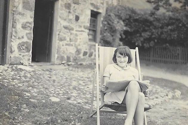 A young Rena Stewart sitting on a deck chair 