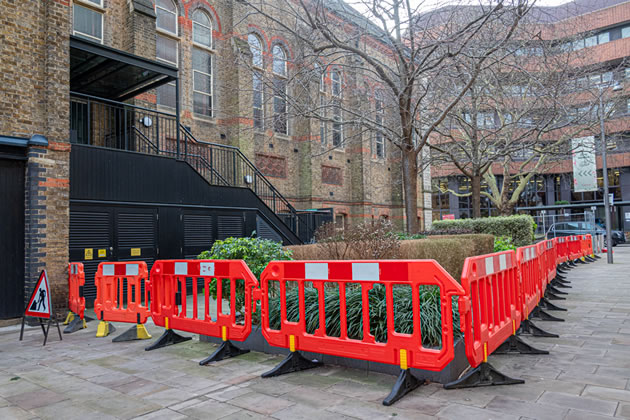 Fenced-off side entrance to the Victoria Hall which along with Ealing Town Hall has been closed since September 2023