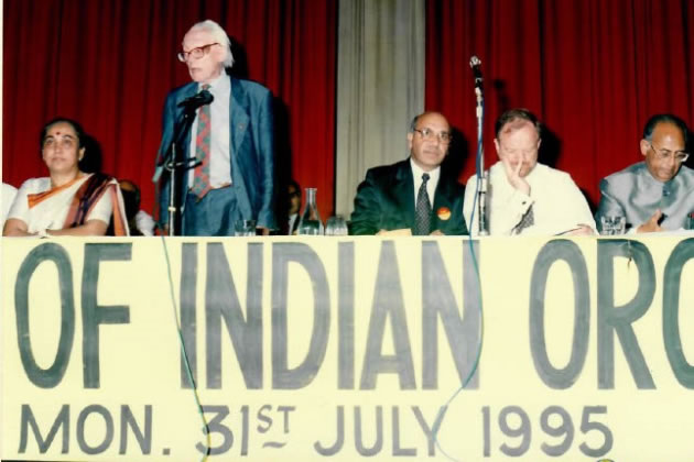 Virendra Sharma on a platform with Michael Foot in 1995