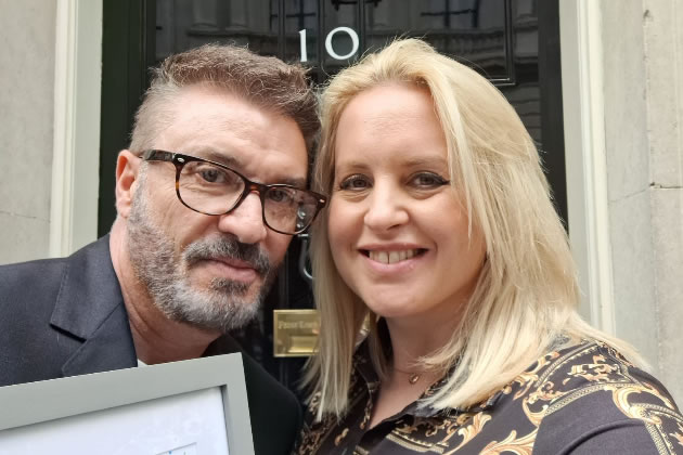 Allan (left) with his award outside Number 10 Downing Street. Picture: @BrentfordPFC 