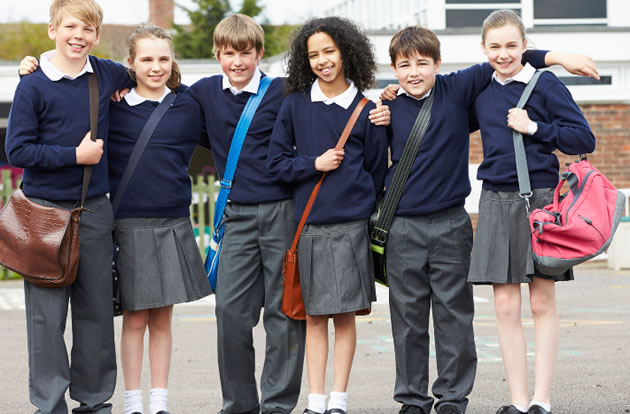 schoolchildren in a group about to head to secondary school 